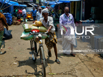 A busy street is bustling at the Chalai market in Thiruvananthapuram (Trivandrum), Kerala, India, on April 13, 2024. The Chalai Market (Chal...