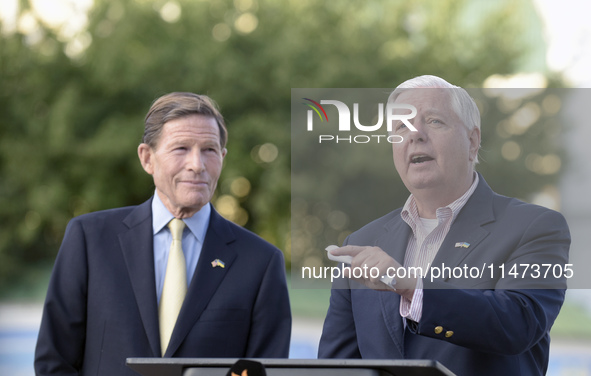 United States Senators Richard Blumenthal (L) and Lindsey Graham are holding a briefing in Mykhailivska Square outside the St. Michael's Gol...