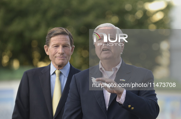 United States Senators Richard Blumenthal (L) and Lindsey Graham are holding a briefing in Mykhailivska Square outside the St. Michael's Gol...