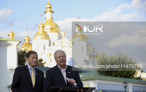 United States Senators Richard Blumenthal (L) and Lindsey Graham are holding a briefing in Mykhailivska Square outside the St. Michael's Gol...