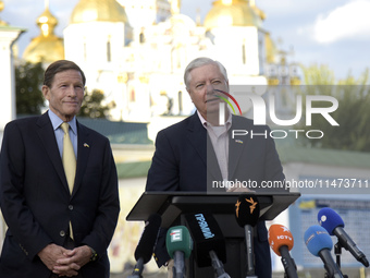 United States Senators Richard Blumenthal (L) and Lindsey Graham are holding a briefing in Mykhailivska Square outside the St. Michael's Gol...