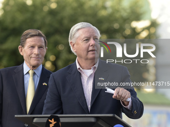 United States Senators Richard Blumenthal (L) and Lindsey Graham are holding a briefing in Mykhailivska Square outside the St. Michael's Gol...