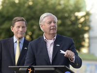 United States Senators Richard Blumenthal (L) and Lindsey Graham are holding a briefing in Mykhailivska Square outside the St. Michael's Gol...