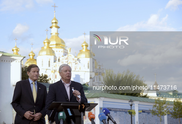 United States Senators Richard Blumenthal (L) and Lindsey Graham are holding a briefing in Mykhailivska Square outside the St. Michael's Gol...