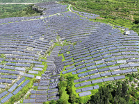 A photovoltaic power station is operating on a barren mountain in Tiankeng village, Shuiquan Town, Zaozhuang Shanting District, Shandong pro...