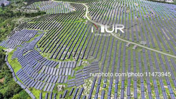 A photovoltaic power station is operating on a barren mountain in Tiankeng village, Shuiquan Town, Zaozhuang Shanting District, Shandong pro...