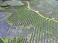 A photovoltaic power station is operating on a barren mountain in Tiankeng village, Shuiquan Town, Zaozhuang Shanting District, Shandong pro...