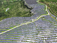 A photovoltaic power station is operating on a barren mountain in Tiankeng village, Shuiquan Town, Zaozhuang Shanting District, Shandong pro...