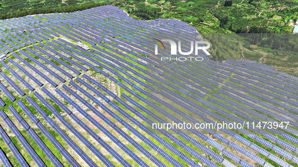 A photovoltaic power station is operating on a barren mountain in Tiankeng village, Shuiquan Town, Zaozhuang Shanting District, Shandong pro...