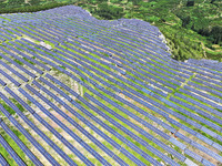 A photovoltaic power station is operating on a barren mountain in Tiankeng village, Shuiquan Town, Zaozhuang Shanting District, Shandong pro...