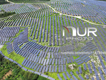 A photovoltaic power station is operating on a barren mountain in Tiankeng village, Shuiquan Town, Zaozhuang Shanting District, Shandong pro...