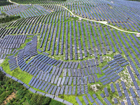 A photovoltaic power station is operating on a barren mountain in Tiankeng village, Shuiquan Town, Zaozhuang Shanting District, Shandong pro...