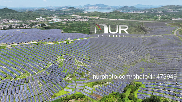 A photovoltaic power station is operating on a barren mountain in Tiankeng village, Shuiquan Town, Zaozhuang Shanting District, Shandong pro...