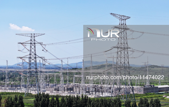 An aerial photo is showing the 1000 kV UHV AC power transmission and transformation project in Zaozhuang, China, on August 12, 2024. The 100...