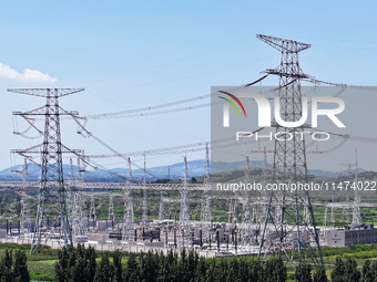 An aerial photo is showing the 1000 kV UHV AC power transmission and transformation project in Zaozhuang, China, on August 12, 2024. The 100...