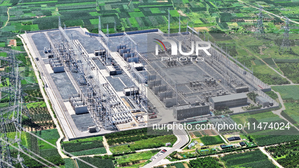 An aerial photo is showing the 1000 kV UHV AC power transmission and transformation project in Zaozhuang, China, on August 12, 2024. The 100...