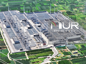 An aerial photo is showing the 1000 kV UHV AC power transmission and transformation project in Zaozhuang, China, on August 12, 2024. The 100...