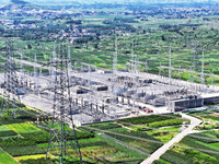 An aerial photo is showing the 1000 kV UHV AC power transmission and transformation project in Zaozhuang, China, on August 12, 2024. The 100...