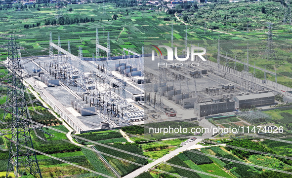 An aerial photo is showing the 1000 kV UHV AC power transmission and transformation project in Zaozhuang, China, on August 12, 2024. The 100...