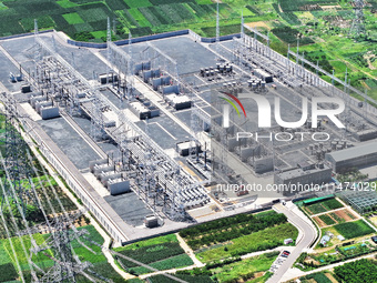 An aerial photo is showing the 1000 kV UHV AC power transmission and transformation project in Zaozhuang, China, on August 12, 2024. The 100...