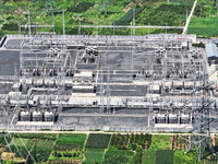 An aerial photo is showing the 1000 kV UHV AC power transmission and transformation project in Zaozhuang, China, on August 12, 2024. The 100...