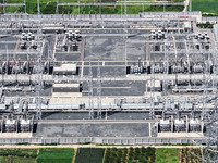 An aerial photo is showing the 1000 kV UHV AC power transmission and transformation project in Zaozhuang, China, on August 12, 2024. The 100...