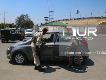 Security personnel are checking a vehicle ahead of India's Independence Day celebrations in Srinagar, Jammu and Kashmir, on August 13, 2024....