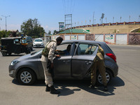 Security personnel are checking a vehicle ahead of India's Independence Day celebrations in Srinagar, Jammu and Kashmir, on August 13, 2024....