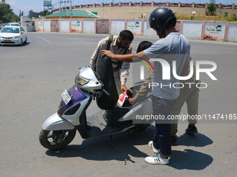 Security personnel are checking a motorist ahead of India's Independence Day celebrations in Srinagar, Jammu and Kashmir, on August 13, 2024...