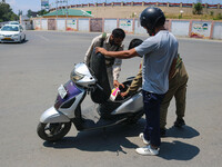 Security personnel are checking a motorist ahead of India's Independence Day celebrations in Srinagar, Jammu and Kashmir, on August 13, 2024...