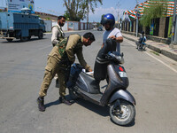 Security personnel are checking a motorist ahead of India's Independence Day celebrations in Srinagar, Jammu and Kashmir, on August 13, 2024...