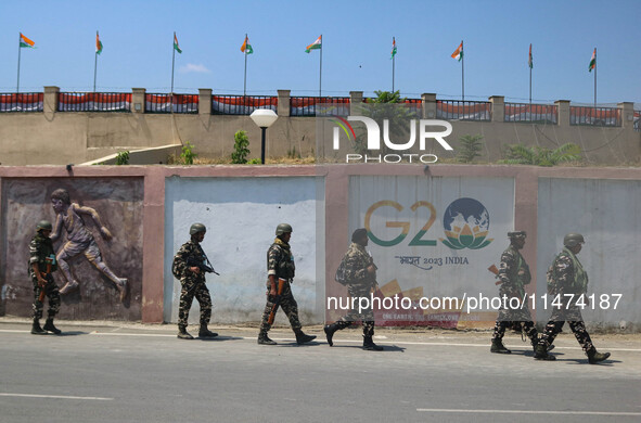 Security personnel are patrolling along a road ahead of India's Independence Day celebrations in Srinagar, Jammu and Kashmir, on August 13,...