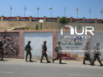 Security personnel are patrolling along a road ahead of India's Independence Day celebrations in Srinagar, Jammu and Kashmir, on August 13,...