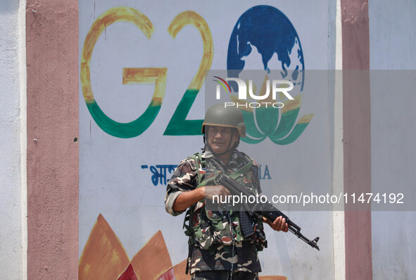 An Indian security personnel is standing alert ahead of India's Independence Day celebrations in Srinagar, Jammu and Kashmir, on August 13,...