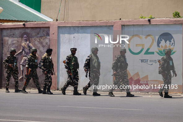 Security personnel are patrolling along a road ahead of India's Independence Day celebrations in Srinagar, Jammu and Kashmir, on August 13,...