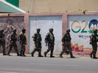 Security personnel are patrolling along a road ahead of India's Independence Day celebrations in Srinagar, Jammu and Kashmir, on August 13,...