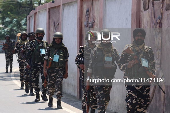 Security personnel are patrolling along a road ahead of India's Independence Day celebrations in Srinagar, Jammu and Kashmir, on August 13,...