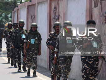 Security personnel are patrolling along a road ahead of India's Independence Day celebrations in Srinagar, Jammu and Kashmir, on August 13,...