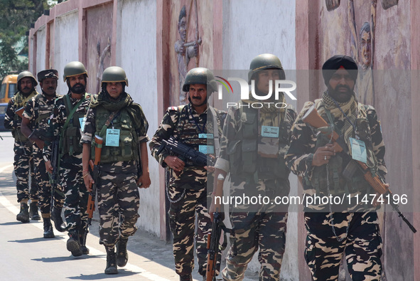 Security personnel are patrolling along a road ahead of India's Independence Day celebrations in Srinagar, Jammu and Kashmir, on August 13,...