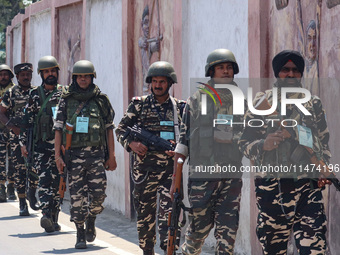 Security personnel are patrolling along a road ahead of India's Independence Day celebrations in Srinagar, Jammu and Kashmir, on August 13,...