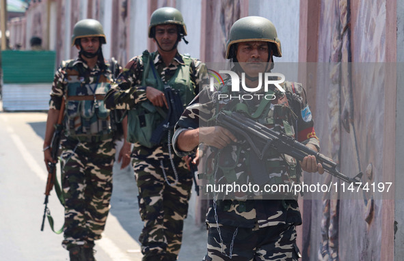 Security personnel are patrolling along a road ahead of India's Independence Day celebrations in Srinagar, Jammu and Kashmir, on August 13,...