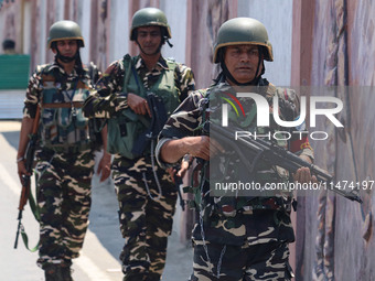 Security personnel are patrolling along a road ahead of India's Independence Day celebrations in Srinagar, Jammu and Kashmir, on August 13,...