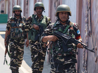 Security personnel are patrolling along a road ahead of India's Independence Day celebrations in Srinagar, Jammu and Kashmir, on August 13,...