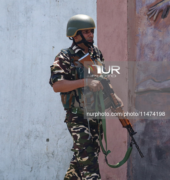 An Indian security personnel is patrolling along a road ahead of India's Independence Day celebrations in Srinagar, Jammu and Kashmir, on Au...