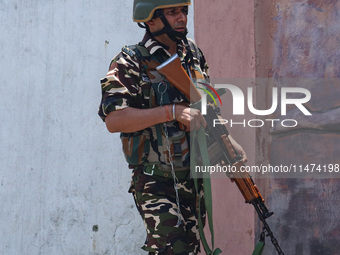 An Indian security personnel is patrolling along a road ahead of India's Independence Day celebrations in Srinagar, Jammu and Kashmir, on Au...