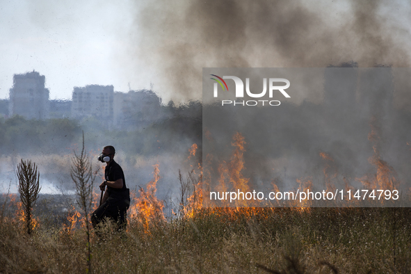 Dry grass and brush are burning between Sofia Airport and Hristo Botev district on August 13, 2024, in Sofia, Bulgaria. Bulgaria is ranking...