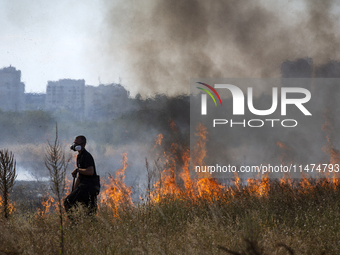 Dry grass and brush are burning between Sofia Airport and Hristo Botev district on August 13, 2024, in Sofia, Bulgaria. Bulgaria is ranking...