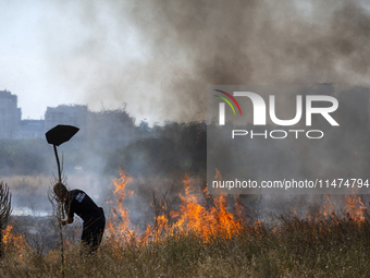 Dry grass and brush are burning between Sofia Airport and Hristo Botev district on August 13, 2024, in Sofia, Bulgaria. Bulgaria is ranking...