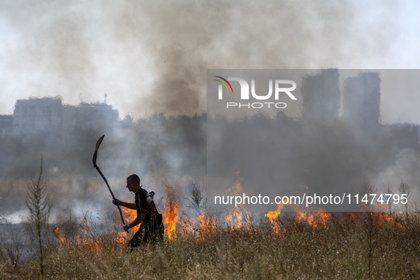 Dry grass and brush are burning between Sofia Airport and Hristo Botev district on August 13, 2024, in Sofia, Bulgaria. Bulgaria is ranking...