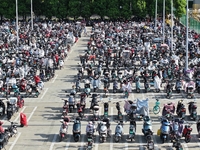 Electric bicycles are being seen at an electric vehicle parking lot near the Suzhou Rail Transit Line 11 Kunshan Huaqiao Station in Suzhou,...